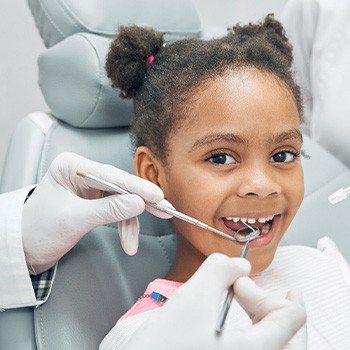 Child smiling during dental checkup