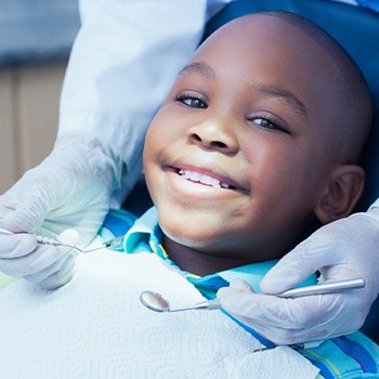 Child smiling at dental checkup