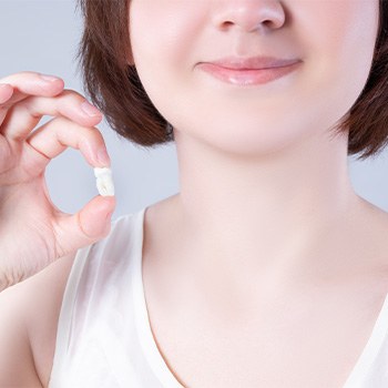 Child holding an extracted tooth