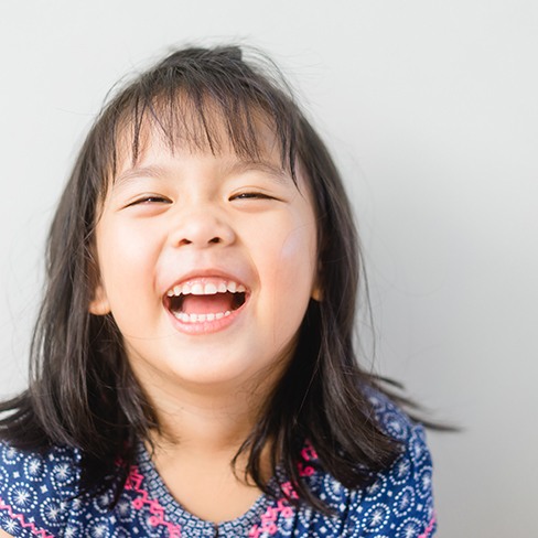 Little girl smiling with an anterior crown