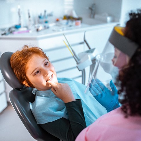 Patient learning about cost of tooth extractions in Towson